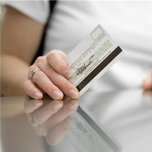 Woman Holding a Credit Card